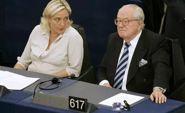 FILE - Jean-Marie Le Pen, right, and his daughter Marine Le Pen sit at the European Parliament, in Strasbourg, eastern France, July 14, 2009. (AP Photo/Lionel Cironneau, File)