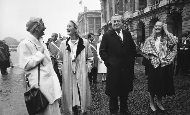 FILE - Leader of the French National Front, Jean Marie Le Pen, second from right, leads a march to the statue of Joan of Arc with his three daughters Marie Caroline, Yann and Marine Le Pen, on May 12, 1985. (AP Photo/Herve Merliac, File)