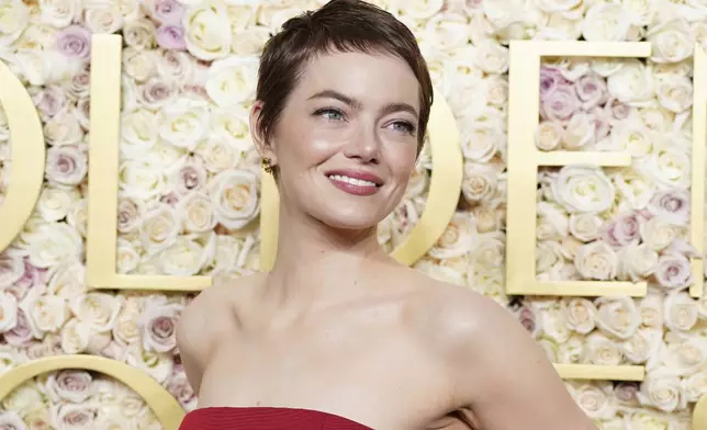 Emma Stone arrives at the 82nd Golden Globes on Sunday, Jan. 5, 2025, at the Beverly Hilton in Beverly Hills, Calif. (Photo by Jordan Strauss/Invision/AP)