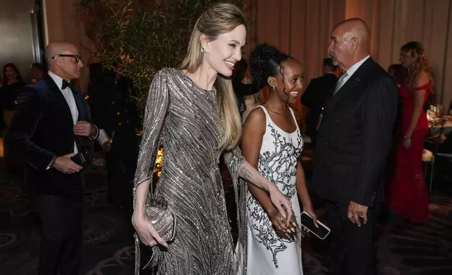 Angelina Jolie, left, and Zahara Marley Jolie arrive at the 82nd Golden Globes on Sunday, Jan. 5, 2025, at the Beverly Hilton in Beverly Hills, Calif. (AP Photo/Chris Pizzello)