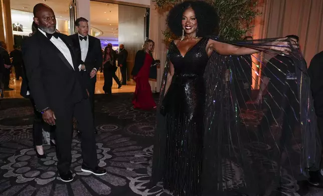 Julius Tennon, left, and Viola Davis arrive at the 82nd Golden Globes on Sunday, Jan. 5, 2025, at the Beverly Hilton in Beverly Hills, Calif. (AP Photo/Chris Pizzello)