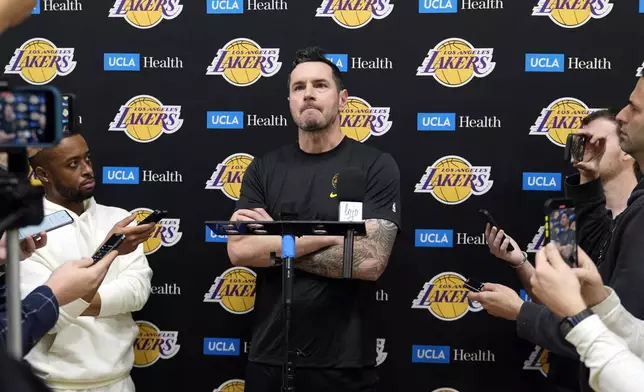 Los Angeles Lakers coach JJ Redick recounts that he and his family lost their house in the deadly Pacific Palisades wildfire during an NBA basketball news conference at the UCLA Health Training Center in El Segundo, Calif., Friday, Jan. 10, 2025. (AP Photo/Damian Dovarganes)