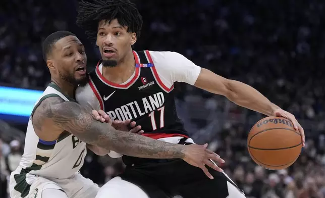 Portland Trail Blazers' Shaedon Sharpe tries to get past Milwaukee Bucks' Damian Lillard during the second half of an NBA basketball game Saturday, Jan. 4, 2025, in Milwaukee. (AP Photo/Morry Gash)