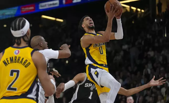 Indiana Pacers guard Tyrese Haliburton (0) shoots against the San Antonio Spurs during the first half of a Paris Games 2025 NBA basketball game in Paris, Saturday, Jan. 25, 2025. (AP Photo/Thibault Camus)