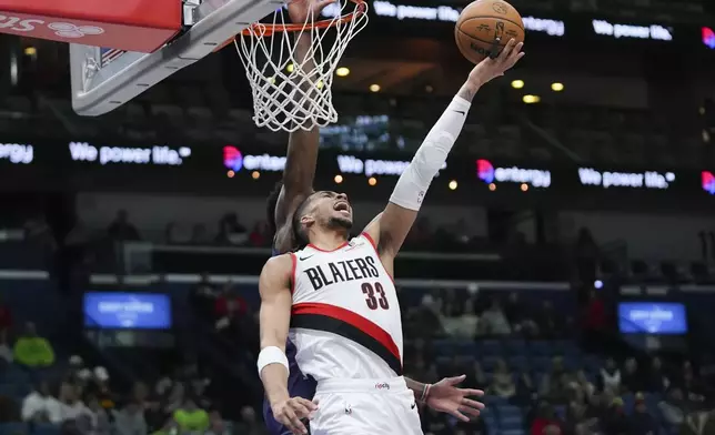 Portland Trail Blazers forward Toumani Camara (33) goes to the basket in the first half of an NBA basketball game against the New Orleans Pelicans in New Orleans, Wednesday, Jan. 8, 2025. (AP Photo/Gerald Herbert)