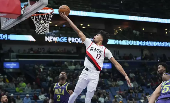 Portland Trail Blazers guard Shaedon Sharpe (17) goes to the basket against New Orleans Pelicans forward Herbert Jones (2) in the first half of an NBA basketball game in New Orleans, Wednesday, Jan. 8, 2025. (AP Photo/Gerald Herbert)