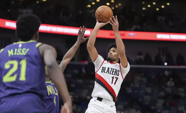 Portland Trail Blazers guard Shaedon Sharpe (17) shoots against New Orleans Pelicans guard Javonte Green in the first half of an NBA basketball game in New Orleans, Wednesday, Jan. 8, 2025. (AP Photo/Gerald Herbert)