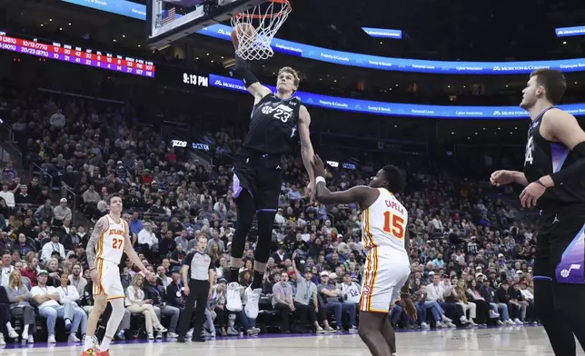 Utah Jazz forward Lauri Markkanen (23) dunks the ball against the Atlanta Hawks during the fourth quarter of an NBA basketball game, Tuesday, Jan. 7, 2025, in Salt Lake City. (AP Photo/Rob Gray)