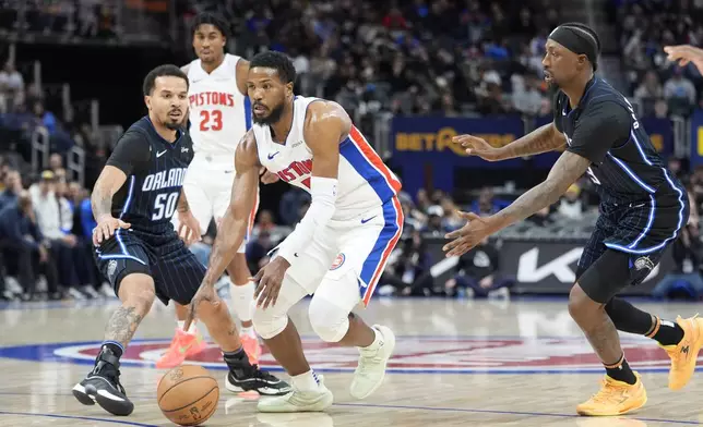 Detroit Pistons guard Malik Beasley (5) passes the ball during the first half of an NBA basketball game against the Orlando Magic, Wednesday, Jan. 1, 2025, in Detroit. (AP Photo/Carlos Osorio)