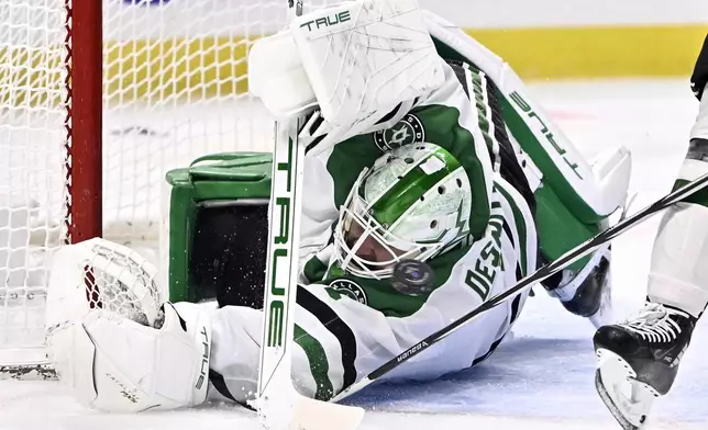 A shot by Ottawa Senators' Tim Stutzle (not shown) beats Dallas Stars goaltender Casey DeSmith for a goal during second-period NHL hockey game action in Ottawa, Ontario, Sunday, Jan. 12, 2025. (Justin Tang/The Canadian Press via AP)
