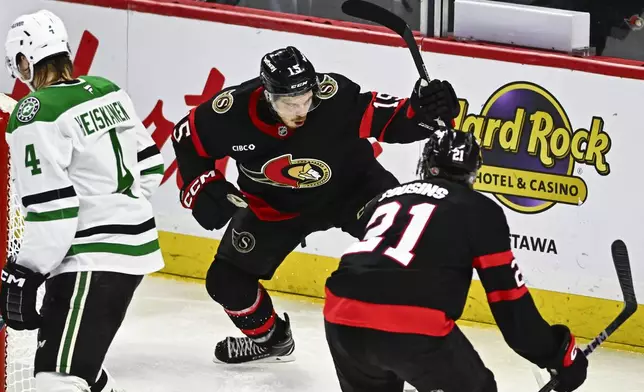 Ottawa Senators' Matthew Highmore (15) celebrates after his goal during third-period NHL hockey game action against the Dallas Stars in Ottawa, Ontario, Sunday, Jan. 12, 2025. (Justin Tang/The Canadian Press via AP)