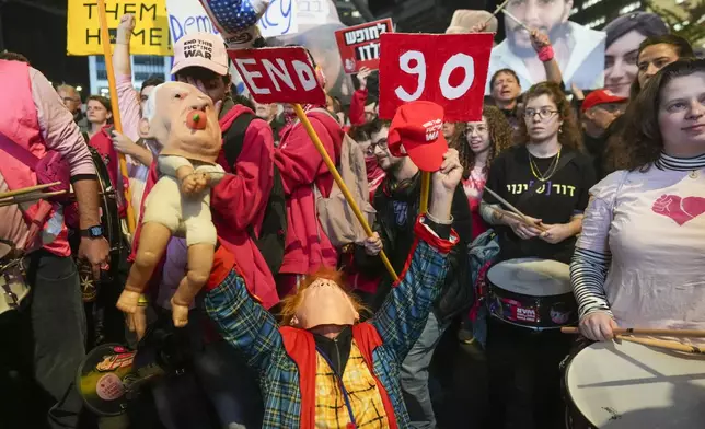 Demonstrators protest calling for the immediate release of the hostages held in the Gaza Strip by the Hamas militant group in Tel Aviv, Israel, Saturday, Jan. 25, 2025. (AP Photo/Ohad Zwigenberg)