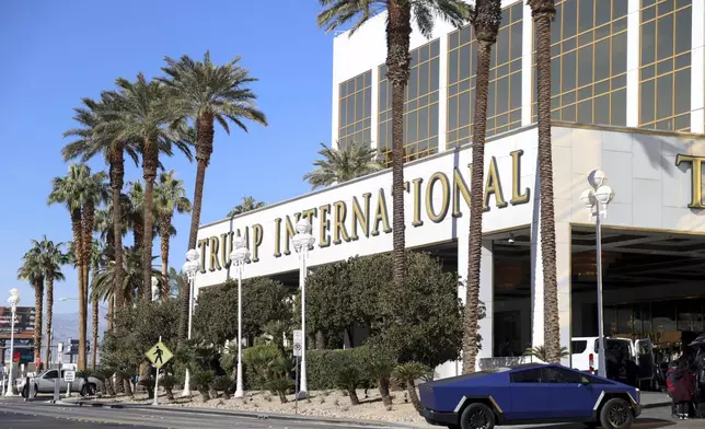 A Tesla Cybertruck pulls into Trump International Hotel in Las Vegas Thursday, Jan. 2, 2025, in Las Vegas. (AP Photo/Ian Maule)