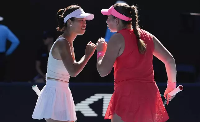 Hsieh Su-Wei, left, of Taiwan and Jelena Ostapenko of Latvia in action against Katerina Sinikova of Czech Republic and Taylor Townsend of the U.S. at the Australian Open tennis championship in Melbourne, Australia, Sunday, Jan. 26, 2025. (AP Photo/Asanka Brendon Ratnayake)