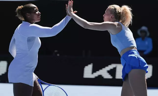 Katerina Sinikova, right, of the Czech Republic and Taylor Townsend of the U.S. react during the women's doubles final against Hsieh Su-Wei of Taiwan and Jelena Ostapenko of Latvia at the Australian Open tennis championship in Melbourne, Australia, Sunday, Jan. 26, 2025. (AP Photo/Asanka Brendon Ratnayake)