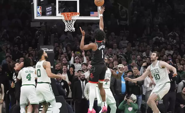 Houston Rockets forward Amen Thompson (1) makes the winning shot against the Boston Celtics during the final seconds of an NBA basketball game, Monday, Jan. 27, 2025, in Boston. (AP Photo/Charles Krupa)