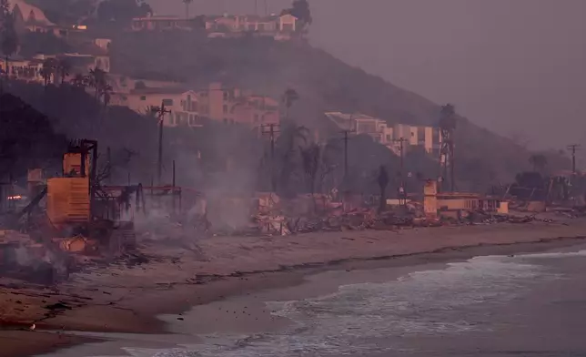 Beach front homes are destroyed by the Palisades Fire Wednesday, Jan. 8, 2025 in Malibu, Calif. (AP Photo/Mark J. Terrill)