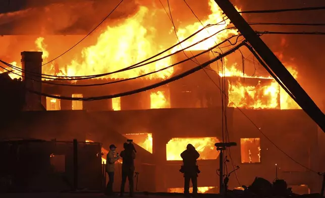 Beach front homes are destroyed by the Palisades Fire Wednesday, Jan. 8, 2025 in Malibu, Calif. (AP Photo/Mark J. Terrill)