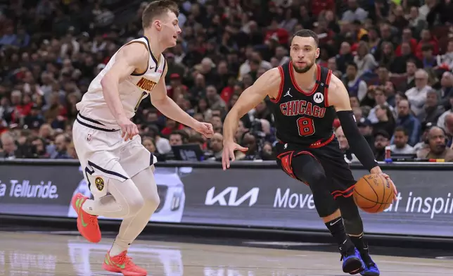 Denver Nuggets guard Christian Braun, left, guards against Chicago Bulls guard Zach LaVine (8) during the first half of an NBA basketball game Monday, Jan. 27, 2025, in Chicago. (AP Photo/Melissa Tamez)