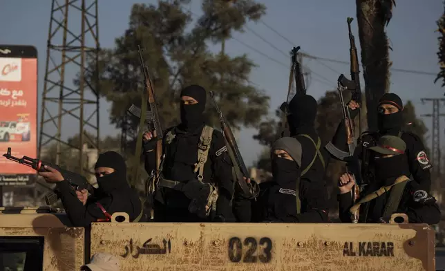 Members of the new security forces take part in an operation to detain, according to the state media, militiamen affiliated with ousted president Bashar Assad in Homs, Syria, Thursday, Jan. 2, 2025. (AP Photo/Leo Correa)