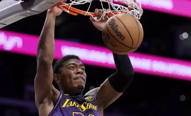 Los Angeles Lakers forward Rui Hachimura dunks during the first half of an NBA basketball game against the Portland Trail Blazers, Thursday, Jan. 2, 2025, in Los Angeles. (AP Photo/Mark J. Terrill)