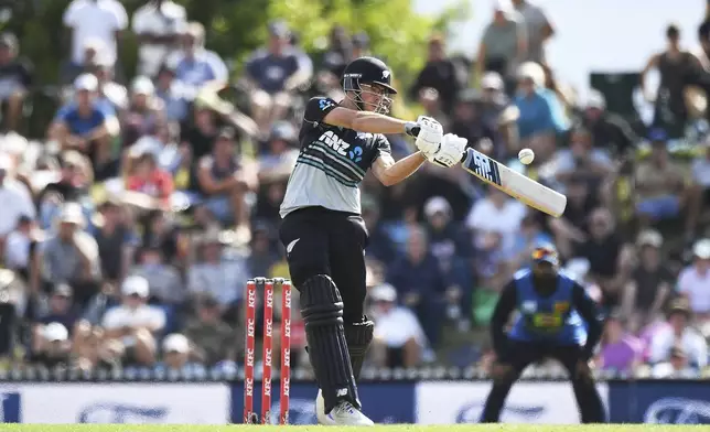 New Zealand's Mitchell Santner plays during the 3rd T20 match between New Zealand and Sri Lanka at Saxton Oval in Nelson, New Zealand, Thursday, Jan. 2, 2025. (Chris Symes/Photosport via AP)