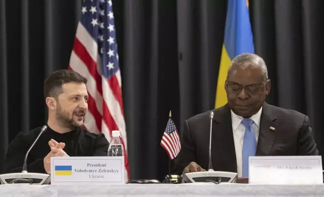 U.S. Secretary of Defense Lloyd Austin, right, and Ukrainian President Volodymyr Zelenskyy attend a meeting of the Ukraine Contact Group at Ramstein Air Base, Germany, Thursday, Jan. 9, 2025. (Marijan Murat/dpa via AP)