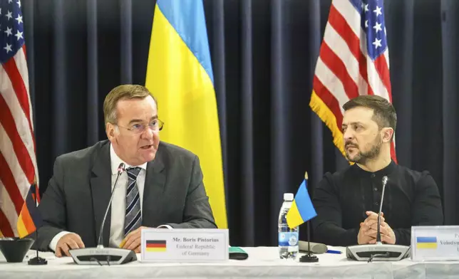 Ukrainian President Volodymyr Zelenskyy, right, and German Defence Minister Boris Pistorius attend a meeting of the Ukraine Contact Group at Ramstein Air Base, Germany, Thursday, Jan. 9, 2025. (Marijan Murat/dpa via AP)