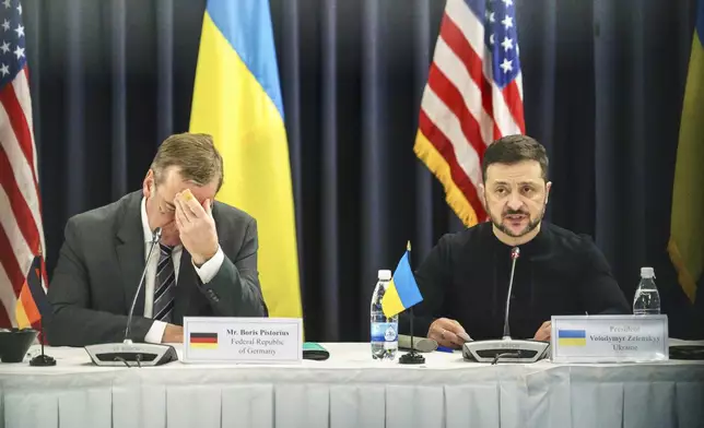 Ukrainian President Volodymyr Zelenskyy, right, and German Defence Minister Boris Pistorius attend a meeting of the Ukraine Contact Group at Ramstein Air Base, Germany, Thursday, Jan. 9, 2025. (Marijan Murat/dpa via AP)