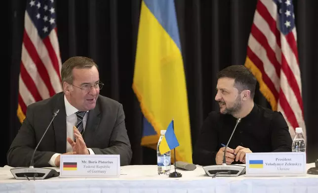 Ukrainian President Volodymyr Zelenskyy, right, and German Defence Minister Boris Pistorius attend a meeting of the Ukraine Contact Group at Ramstein Air Base, Germany, Thursday, Jan. 9, 2025. (Marijan Murat/dpa via AP)