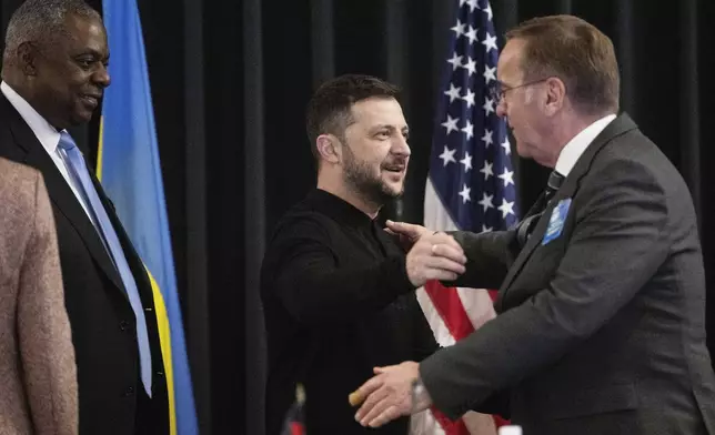 From left: U.S. Secretary of Defense Lloyd Austin, Ukrainian President Volodymyr Zelenskyy and German Defence Minister Boris Pistorius attend a meeting of the Ukraine Contact Group at Ramstein Air Base, Germany, Thursday, Jan. 9, 2025. (Marijan Murat/dpa via AP)