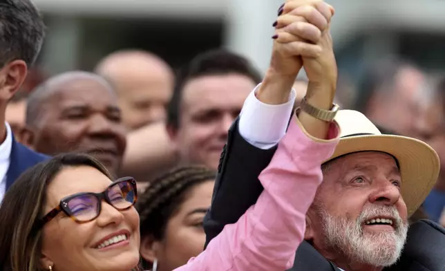 Brazilian President Luiz Inácio Lula da Silva and his wife Rosangela da Silva attend a pro-democracy event marking two years since the alleged coup attempt when supporters of former President Jair Bolsonaro invaded government buildings and called for military intervention, in Brasilia, Brazil, Wednesday, Jan. 8, 2025. (AP Photo/Eraldo Peres)