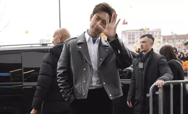 Li Xian arrives as he attends at the men's Prada Fall-Winter 2025-2026 collection show, that was presented in Milan, Italy, Sunday, Jan. 19, 2025. (AP Photo/Antonio Calanni)