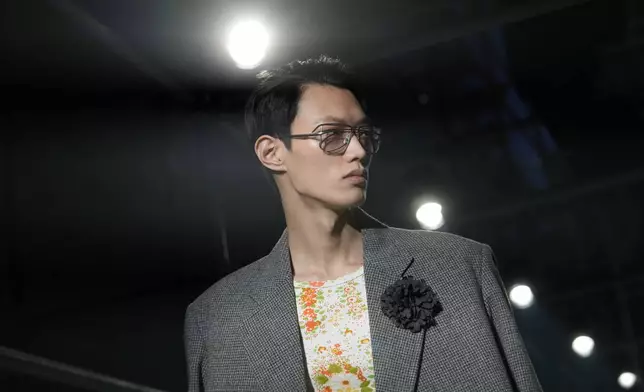 A model wears a creation part of the men's Prada Fall-Winter 2025-2026 collection, that was presented in Milan, Italy, Sunday, Jan. 19, 2025. (AP Photo/Luca Bruno)