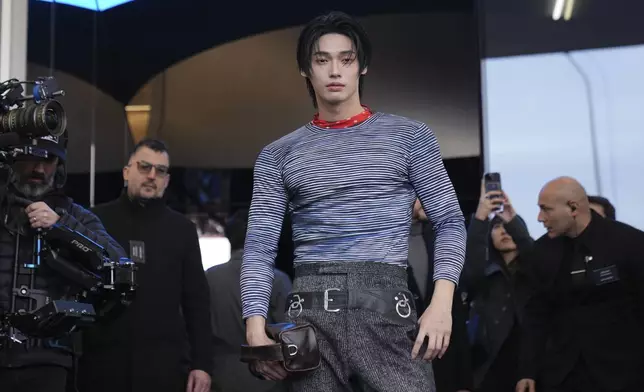 Win Metawin Opas-iamkajorn arrives as he attends at the men's Prada Fall-Winter 2025-2026 collection show, that was presented in Milan, Italy, Sunday, Jan. 19, 2025. (AP Photo/Antonio Calanni)