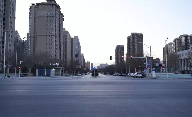 A usually busy road is almost empty as most people working in Beijing have left to celebrate with their families at home for the coming Lunar New Year in China on Tuesday, Jan. 28, 2025. (AP Photo/Aaron Favila)