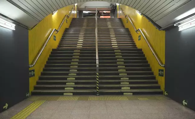 The usually busy stairs at a train station are empty as most people working in Beijing have left to celebrate with their families at home for the coming Lunar New Year in China on Tuesday, Jan. 28, 2025. (AP Photo/Aaron Favila)