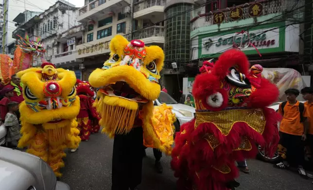 Chinese artists perform a lion dance during a Lunar New Year celebration at Chinatown in Yangon, Myanmar, Wednesday, Jan. 29, 2025. (AP Photo/Thein Zaw)