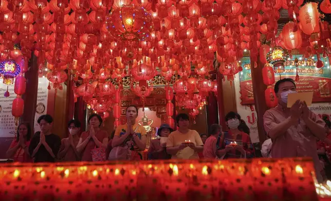 Ethnic Chinese Thais pray at Leng Nuei Yee Temple to celebrate the Lunar New Year in Bangkok, Thailand, Wednesday, Jan. 29, 2025. (AP Photo/Sakchai Lalit)