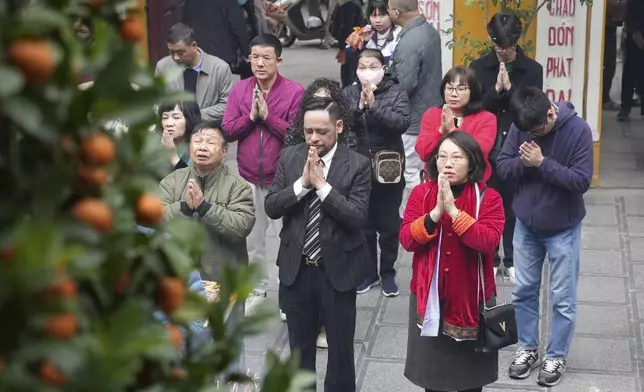 People pray on the first day of the Lunar New Year at Quan Su pagoda in Hanoi, Vietnam Wednesday, Jan. 29, 2025. (AP Photo/Hau Dinh)