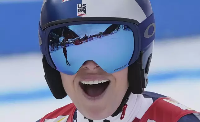 United States Lindsey Vonn reacts after completing an alpine ski, women's World Cup super G race, in St. Anton, Austria, Sunday, Jan. 12, 2025. (AP Photo/Giovanni Auletta)