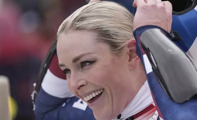 United States Lindsey Vonn reacts after completing an alpine ski, women's World Cup super G race, in St. Anton, Austria, Sunday, Jan. 12, 2025. (AP Photo/Giovanni Auletta)