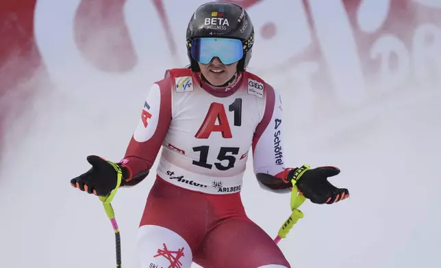 Austria's Stephanie Venier reacts after completing an alpine ski, women's World Cup super G race, in St. Anton, Austria, Sunday, Jan. 12, 2025. (AP Photo/Giovanni Auletta)
