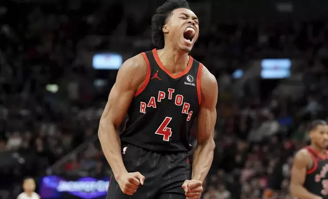 Toronto Raptors forward Scottie Barnes (4) celebrates a basket during the first half of an NBA basketball game against the Orlando Magic, Friday, Jan. 3, 2025 in Toronto. (Frank Gunn/The Canadian Press via AP)