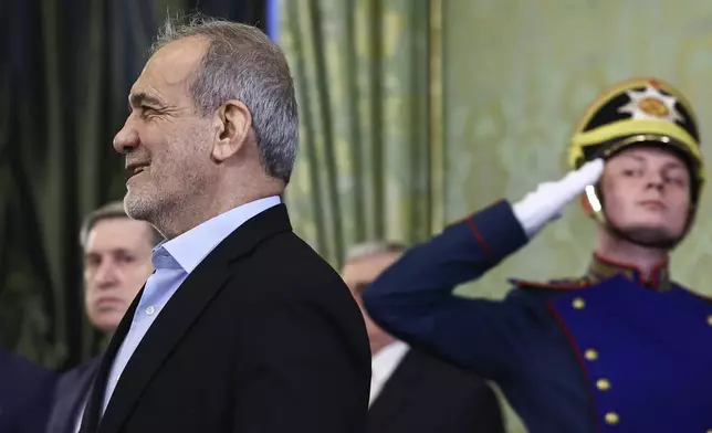 Iranian President Masoud Pezeshkian enters a hall to meet with Russian President Vladimir Putin at the Kremlin in Moscow, Russia, Friday, Jan. 17, 2025. (Evgenia Novozhenina/Pool Photo via AP)