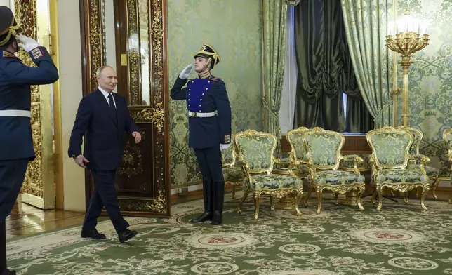 Russian President Vladimir Putin arrives to meet Iranian President Masoud Pezeshkian at the Kremlin in Moscow, Russia, Friday, Jan. 17, 2025. (Vyacheslav Prokofyev, Sputnik, Kremlin Pool Photo via AP)