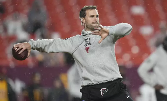 Atlanta Falcons quarterback Kirk Cousins warms up before an NFL football game against the Washington Commanders, Sunday, Dec. 29, 2024, in Landover. (AP Photo/Stephanie Scarbrough)