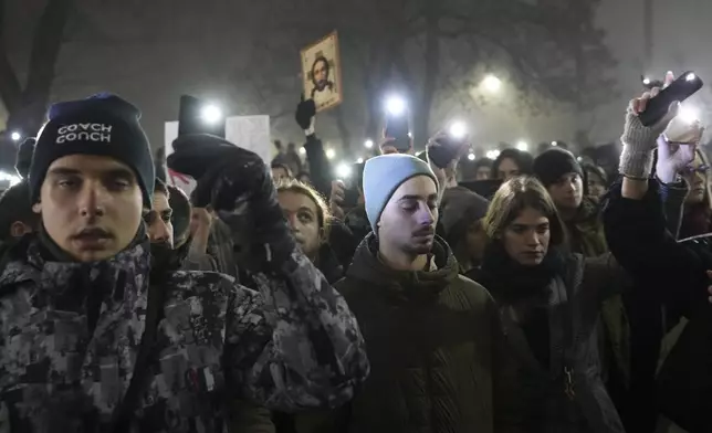 Students march on New Years Eve during a protest that erupted after a concrete canopy fell two months ago and killed 15 people in Belgrade, Serbia, Tuesday, Dec. 31, 2024. (AP Photo/Darko Vojinovic)