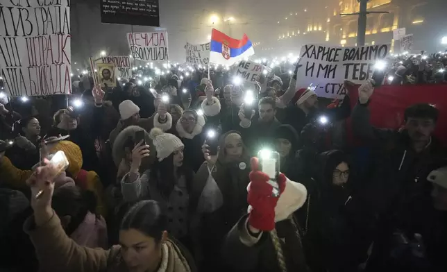 Students march on New Years Eve during a protest that erupted after a concrete canopy fell two months ago and killed 15 people in Belgrade, Serbia, Tuesday, Dec. 31, 2024. (AP Photo/Darko Vojinovic)