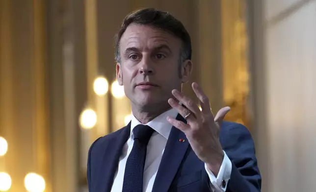 French President Emmanuel Macron delivers his speech to French ambassadors posted around the world, Monday, Jan. 6, 2025 at the Elysee Palace in Paris. (AP Photo/Aurelien Morissard, Pool)